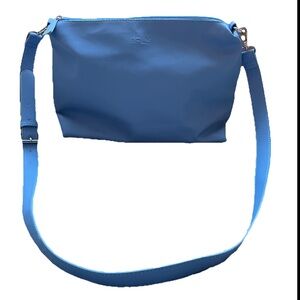 iFLY Blue Crossbody Bag with adjustable strap and zipper closure.